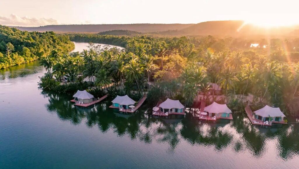 Aerial view of eco-tent villas on the river in Cambodia