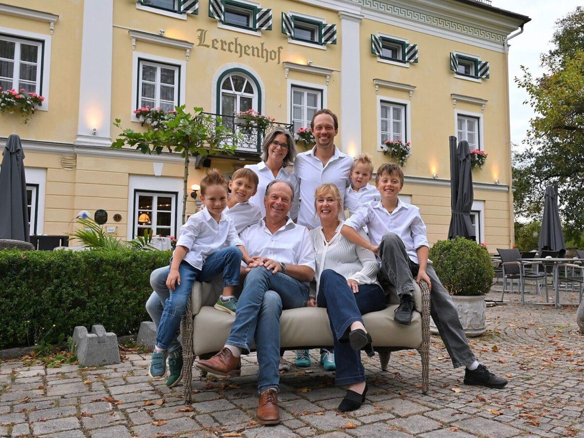 Three generations of the Steinwender family in front of the sustainable Lerchenhof Castle