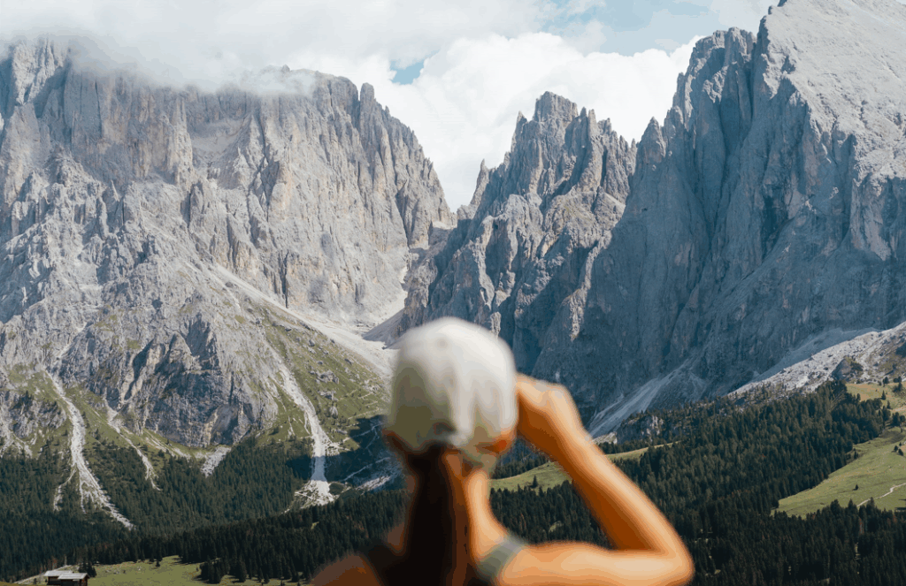 Sustainable Vacation in the Dolomites - Woman Gazing at the Mountains